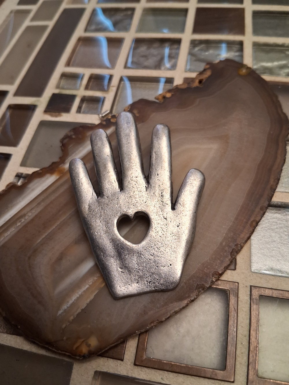 Artisan Silver Hand-Shaped Brooch with Heart Cutout